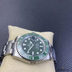 Wrist shot of Submariner Hulk on steel Oyster bracelet in natural lighting