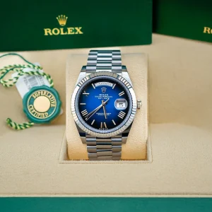 Day-Date 228236-0024 with blue ombré dial, shown in a green display box