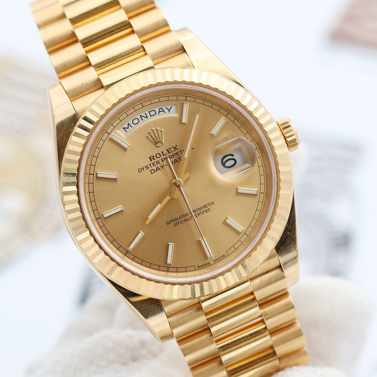 Rolex Day-Date yellow gold with champagne dial showing Monday day display
