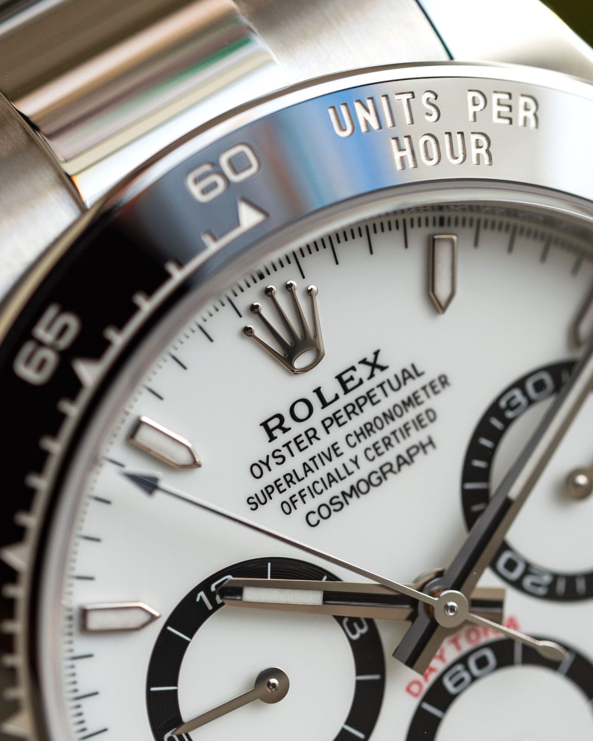 Rolex Daytona Panda dial close-up showing COSMOGRAPH text and subdials