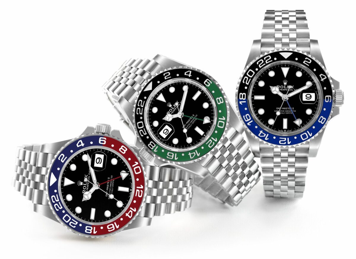 Three Rolex GMT-Master II watches side by side — Pepsi Batman and Sprite bezels on Jubilee bracelets