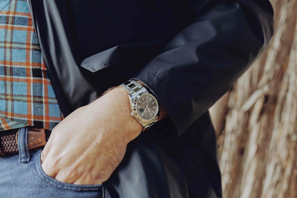 Rolex watch under shirt cuff showing thickness and fit for dress wear