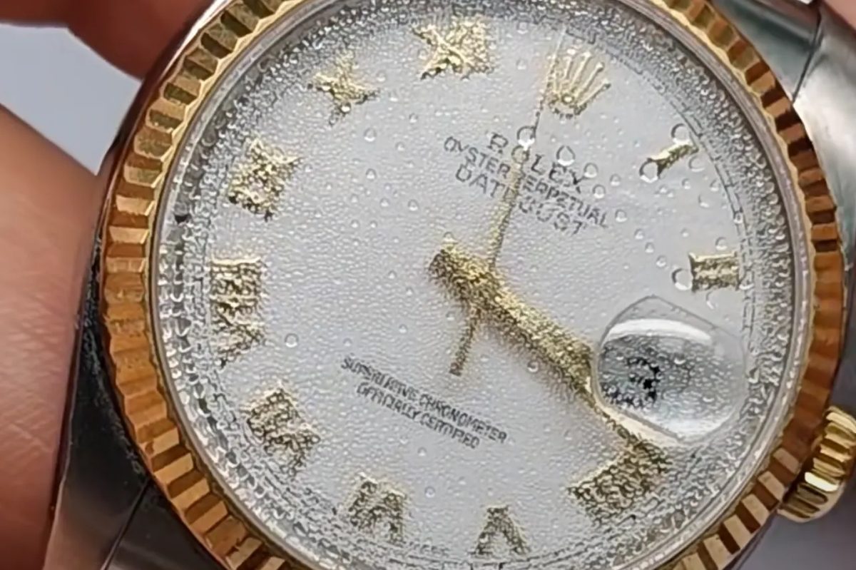 Watch crystal with moisture condensation showing water damage warning signs
