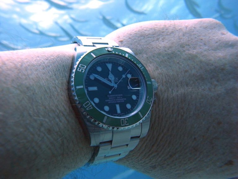 Rolex Submariner fully submerged underwater showing water resistance of dive watch design
